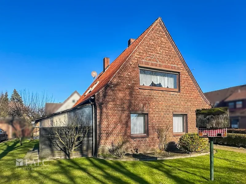 Blick auf die überdachte Terrasse - Haus kaufen in Oldendorf - Handwerkertraum mit zusätzlichem Baugrundstück in bevorzugter Lage von Oldendorf