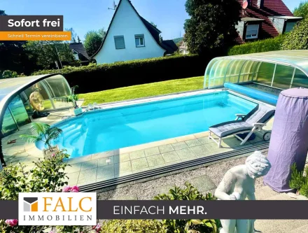 falc-overlay-image-[TIME] - Haus kaufen in Remscheid - Vielseitiges Wohn- und Geschäftshaus mit Garagen/Werkstatt und Gartenoase