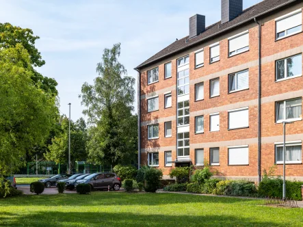 Immobilienansicht seitlich - Wohnung kaufen in Hannover / Vahrenheide - Schöne 3-Zimmer-Wohnung mit Balkon in guter Lage