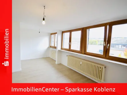 Wohnzimmer - Wohnung kaufen in Koblenz - Vermietete Wohnung am Grünzug Neuendorf-Wallersheim