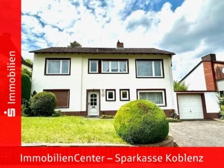  - Haus kaufen in Urbar - Freistehendes Einfamilienhaus in Urbar mit sonnigem Garten