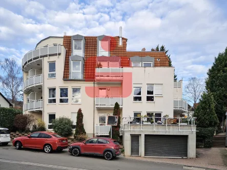  - Wohnung kaufen in Grünstadt - Vermietete Dachgeschosswohnung mit Balkon und Stellplatz