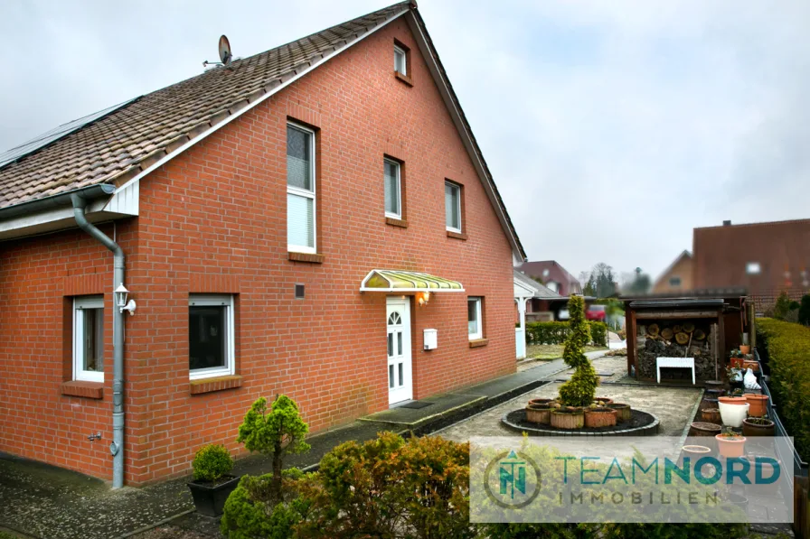 Außenansicht - Haus kaufen in Hanstedt - Kleinfamilien voraus: Doppelhaushälfte mit Garten und sonniger Terrasse