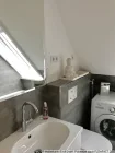 Badezimmer mit Waschmaschine