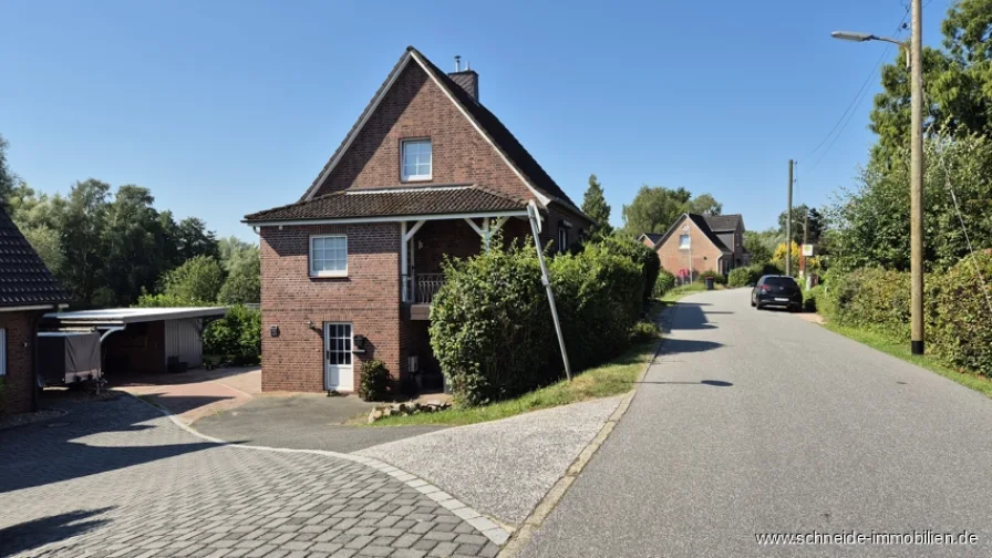 Titelbild - Haus kaufen in Hamburg / Ochsenwerder - Familienfreundliches Wohnen: Einfamilienhaus mit Wintergarten nahe Hohendeicher See