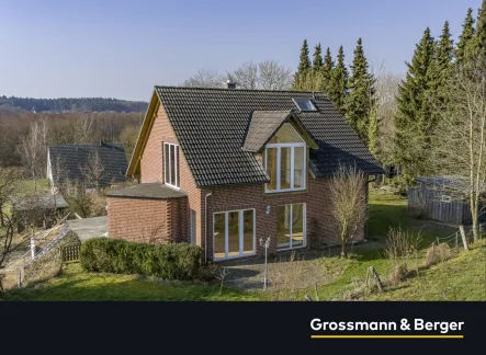 Außenansicht - Haus kaufen in Thomasburg - Architektenhaus - lichtdurchflutet und naturnah