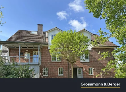 Außenansicht - Wohnung kaufen in Winsen - Große Maisonettewohnung mit eigenem Garten