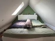 Schlafzimmer im Spitzboden