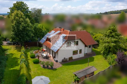 Luftbild - Haus kaufen in Melle - Platzprobleme? Lust auf Garten?Hier ist Ihre Familienoase!