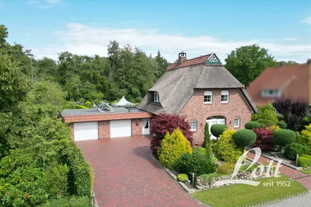 "Eingegrünte" und ruhige Wohnlage - Haus kaufen in Edewecht - +++ Besonderes Reetdach-Anwesen mit imposanter Gartenanlage! +++