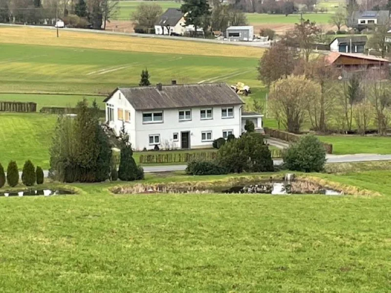 Bild1 - Haus kaufen in Bad Essen - Einfamilienhaus mit Einliegerwohnung (auch nur als Einfamilienhaus nutzbar) in  landschaftlich reizvoller Alleinlage am Fuße des Wiehengebirges