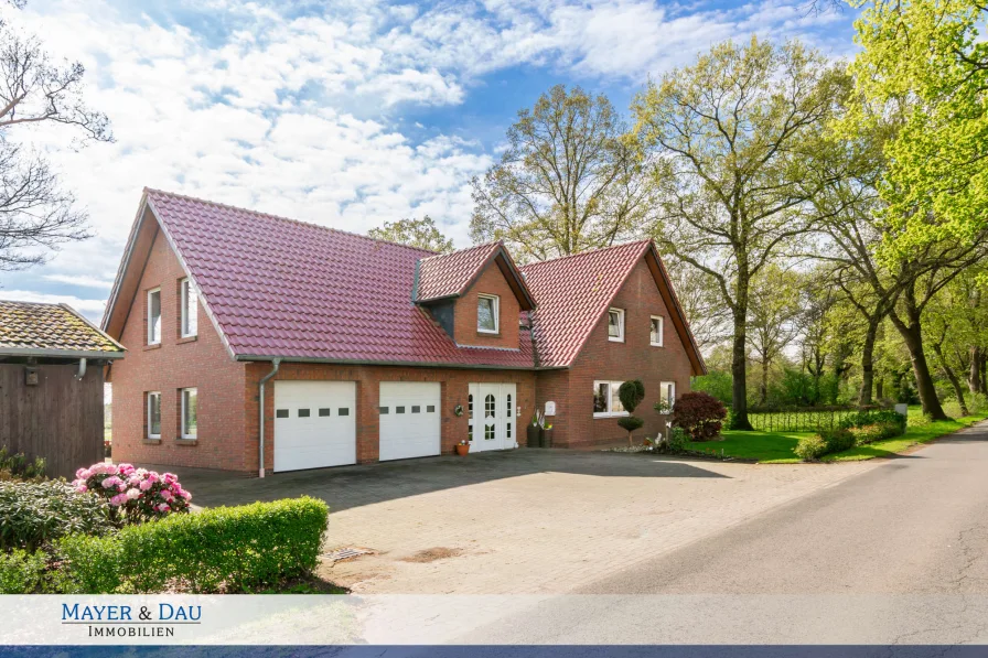 Titelbild - Haus kaufen in Westerstede - Gepflegtes Einfamilienhaus mit Einliegerwohnung in ländlicher Lage, Obj. 7448