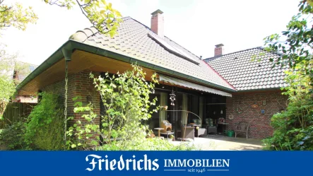  - Haus kaufen in Edewecht - Solider Bungalow mit ausgebautem Dachgeschoss, Terrasse und Garage in ruhiger Lage in Edewecht-Wildenloh