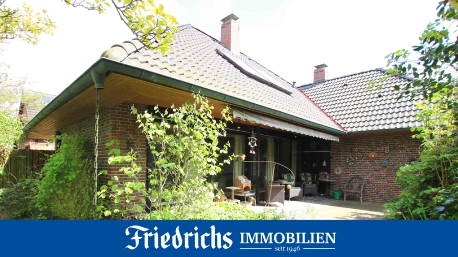  - Haus kaufen in Edewecht - Solider Bungalow mit ausgebautem DG, Terrasse und Garage in ruhiger Lage in Edewecht-Wildenloh