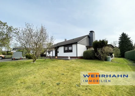 Titelbild - Haus kaufen in Wohltorf - Voll unterkellerter Bungalow auf einem schönen Grundstück in einer familienfreundlichen Wohnlage