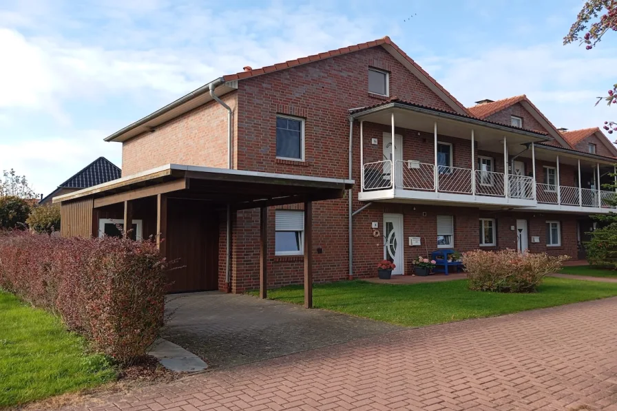 Vorderansicht - Wohnung kaufen in Butjadingen - Sonnig - ruhig gelegen - vermietete Erdgeschosswohnung mit Terrasse an der Nordsee!