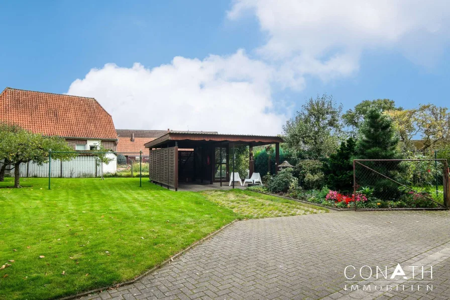 Conath-Immobilien_Harsefeld_Buxtehude_Fredenbeck - So könnte der Blick in den Garten mit Carport aussehen