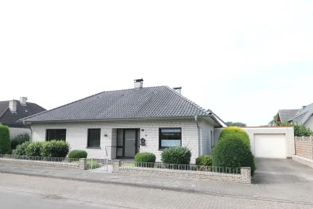 Bild - Haus kaufen in Molbergen - Topgepflegtes, ebenerdiges Wohnhaus mit Keller, Garage ,Geräteraum, Wintergarten und schönem Garten