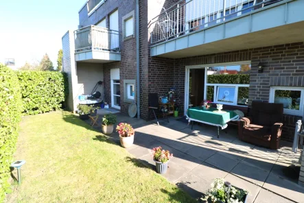 Bild - Wohnung kaufen in Cloppenburg - Topzentrale, moderne Erdgeschosswohnung mit überdachter Terrasse, Garten, Keller und Pkw-Stellplatz