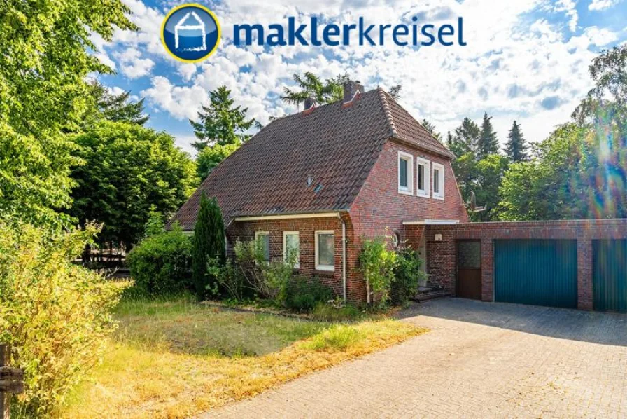 Außen - Haus kaufen in Friedeburg , Ostfriesl - Fest vermietet: Solides Einfamilienhaus mit Garage in Horsten