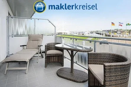 Balkon - Wohnung kaufen in Esens OT Bensersiel - TOP-Lage am Hafen! Barrierefreie Ferienwohnung mit Tiefgaragenstellplatz