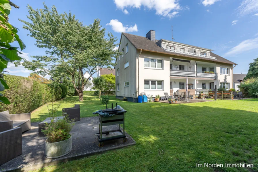 Blick in den Garten - Haus kaufen in Eutin / Neudorf - Kapitalanlage: gut vermietetes Mehrfamilienhaus in Eutin