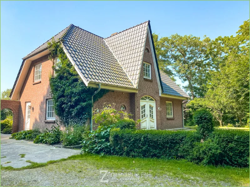 Ansicht - Haus kaufen in Uelvesbüll - Ein ganz besonderes Zuhause - Schwedischer Kachelofen mit Weitblick**