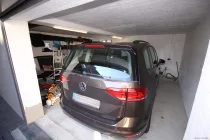 Garage mit seitlichen Abstellbereich