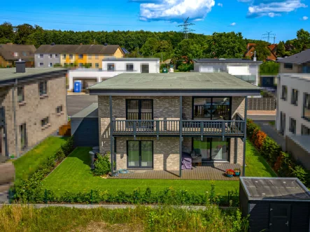 Titel - Haus kaufen in Kappeln - Modernes Traumhaus auf den Schleiterrassen: Ihr neues Zuhause mit Bootsliegeplätzen vor der Haustür!