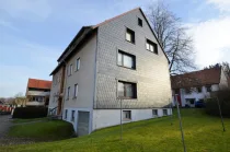 Heise Immobilien - 6-Familienwohnhaus mit Garagen - Delligsen