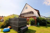 Eigentumswohnung mit Gartenanteil Balkon und Garage - Heise Immobilien