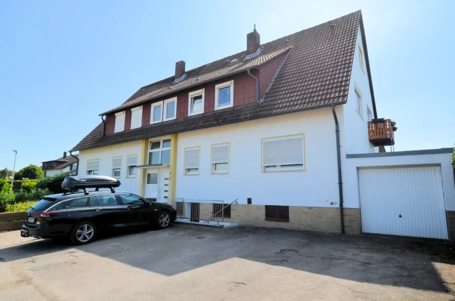 Eigentumswohnung mit Gartenanteil Balkon und Garage - Heise Immobilien