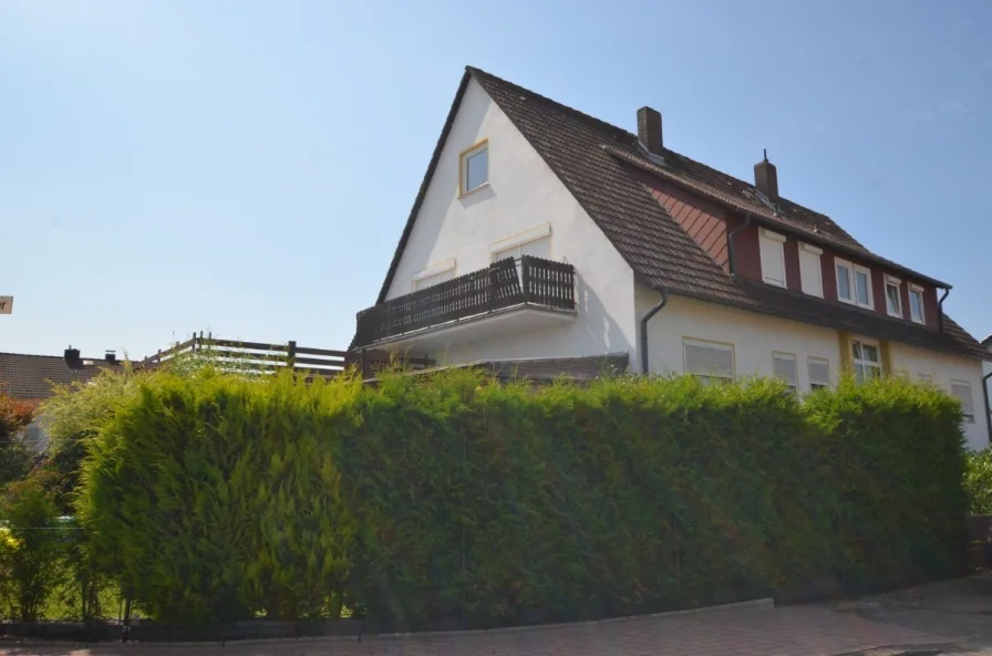 Eigentumswohnung mit Gartenanteil Balkon und Garage - Heise Immobilien