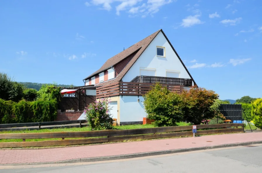 Eigentumswohnung mit Gartenanteil Balkon und Garage - Heise Immobilien