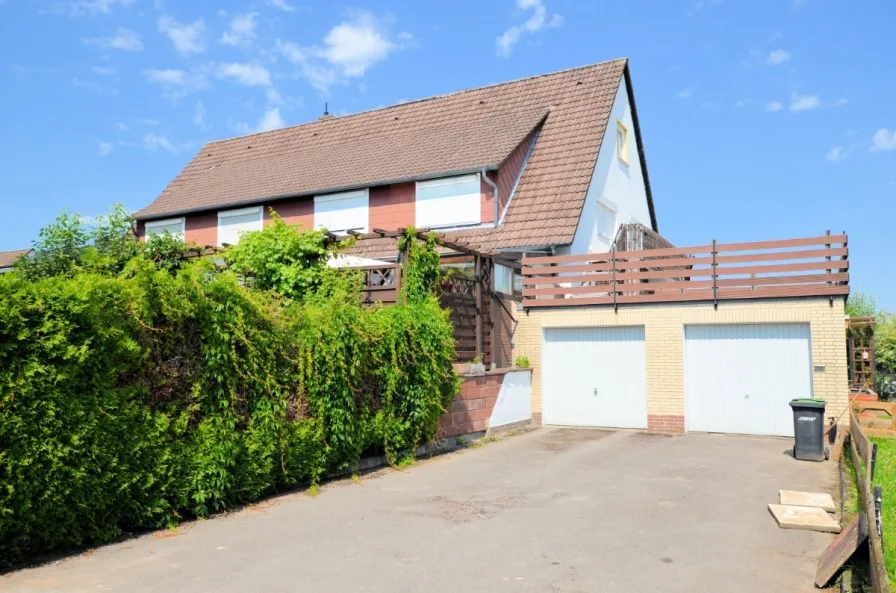 Eigentumswohnung mit Gartenanteil Balkon und Garage - Heise Immobilien