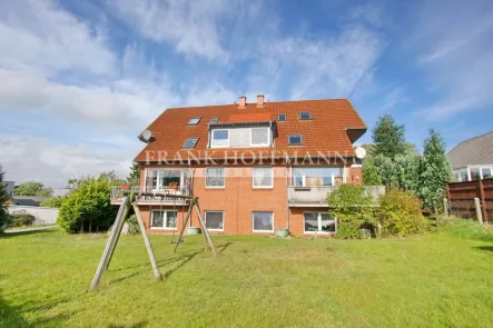 Rückansicht - Wohnung mieten in Kattendorf - 2-Zimmer-Souterrainwohnung mit Terrasse und Stellplatz in Kattendorf