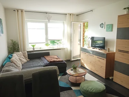 Wohn- und Esszimmer - Wohnung kaufen in Friedrichskoog - Modern und gemütlich: Hochwertig sanierte Eigentumswohnung in Friedrichskoog-Spitze!