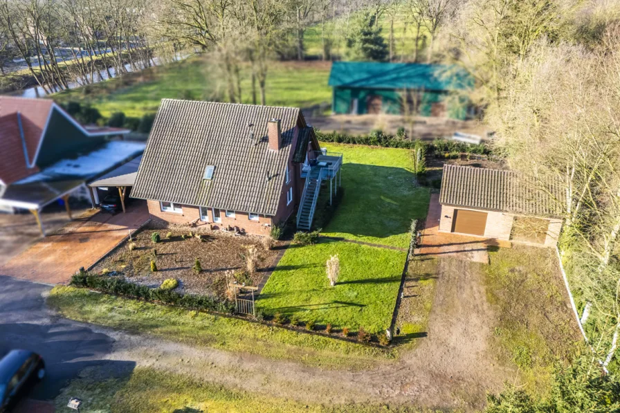 1 - Haus kaufen in Twist / Schöninghsdorf - Tolles EFH in Twist-Schöninghsdorf – Wohnen mit Privatsphäre und viel Natur