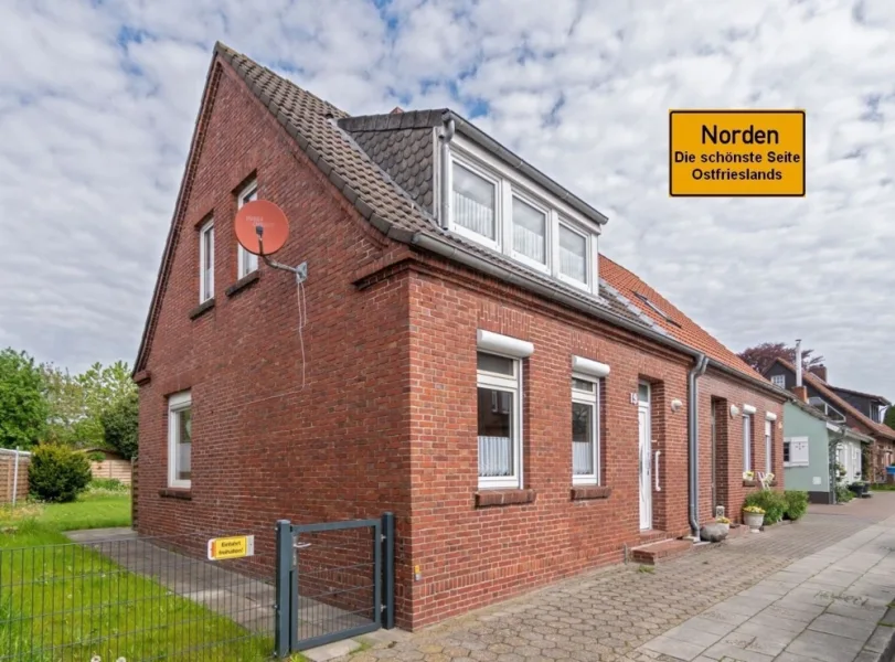 7846 Titelbild mit Ortsschild - Haus kaufen in Norden - Ansprechende Doppelhaushälfte mit gelungener Aufteilung im Kern der Stadt Norden!