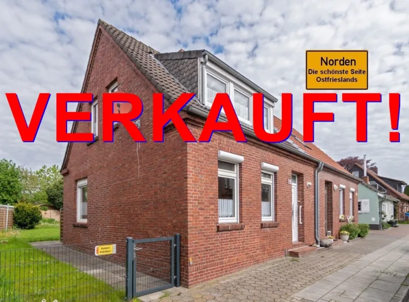 7846 Titelbild mit Ortsschild verkauft - Haus kaufen in Norden - Ansprechende Doppelhaushälfte mit gelungener Aufteilung im Kern der Stadt Norden!