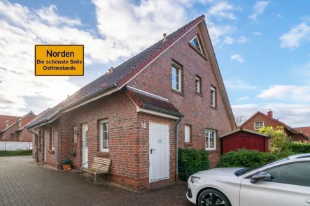 7868 Titelbild mit Ortsschild - Haus kaufen in Norden - Gelungen aufgeteiltes Reihenendhaus in hervorragender Wohnlage zwischen Norden und Norddeich!