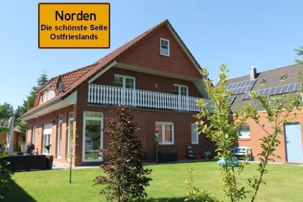 7582 Titelbild mit Ortsschild - Wohnung mieten in Norden - Geräumige Erdgeschosswohnung in beliebter Lage von Norden in Richtung Gymnasium!