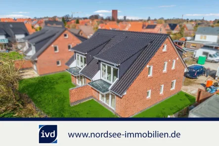 Neubau  - Wohnung kaufen in Norden - Feine Neubau-Wohnung mit Wärmepumpe in Norden n. Norddeich