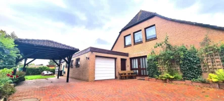 Am Friesenkirchhof 2 - Haus kaufen in Butjadingen - Großzügiges Einfamilienhaus an der Nordsee mit parkänlichem Garten und viel Potential