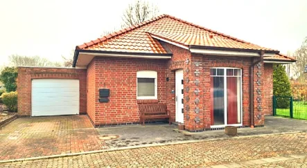 Udo Knauel Str1 - Haus kaufen in Butjadingen - Einziehen und genießen - Komfortabler Bungalow mit Wintergarten an der Nordsee