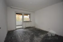 Schlafzimmer mit Zugang zum Balkon