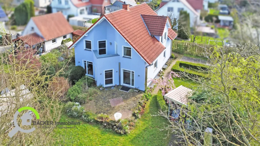 Terrasse-Garten-Ansicht - Haus kaufen in Georgsmarienhütte / Kloster Oesede - Kommen und wohlfühlen in Kloster-OesedeTolles EFH mit vielen Extras zu verkaufen.