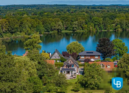 Nahe des Dieksees - Haus kaufen in Plön / Niederkleveez - Exklusives Anwesen in Seenähe mit vermieteter Wohneinheit im Dachgeschoss!