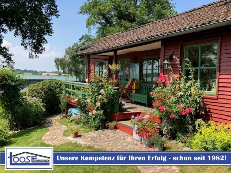 24315 LooseImmo Titel Neu - Logo - Haus kaufen in Scharbeutz / Klingberg - Wochenendhaus mit Seeblick und Traumgartenin Scharbeutz–Klingberg