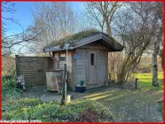 Blockbohlensauna mit Ausendusche und Wasserfass